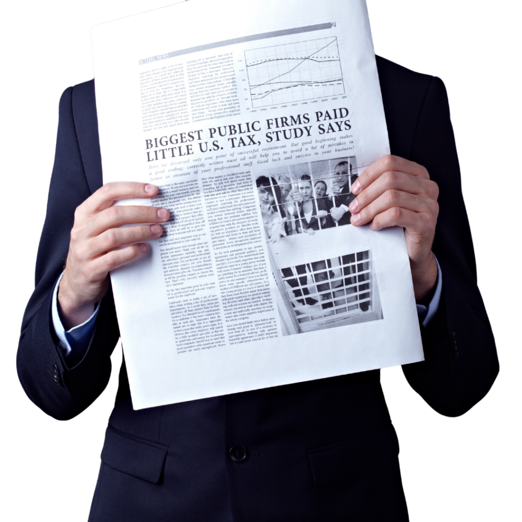 man in a blue suite holding a newspaper